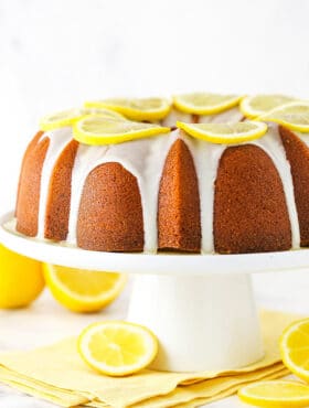 Lemon pound cake with lemon icing on a serving platter.