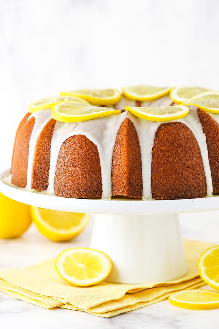 Lemon pound cake with lemon icing on a serving platter.