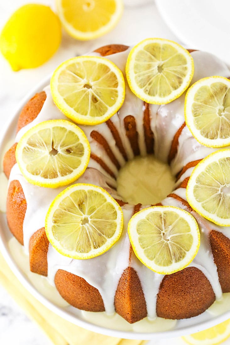 Aerial view of a lemon bundt cake garnished with lemon slices.