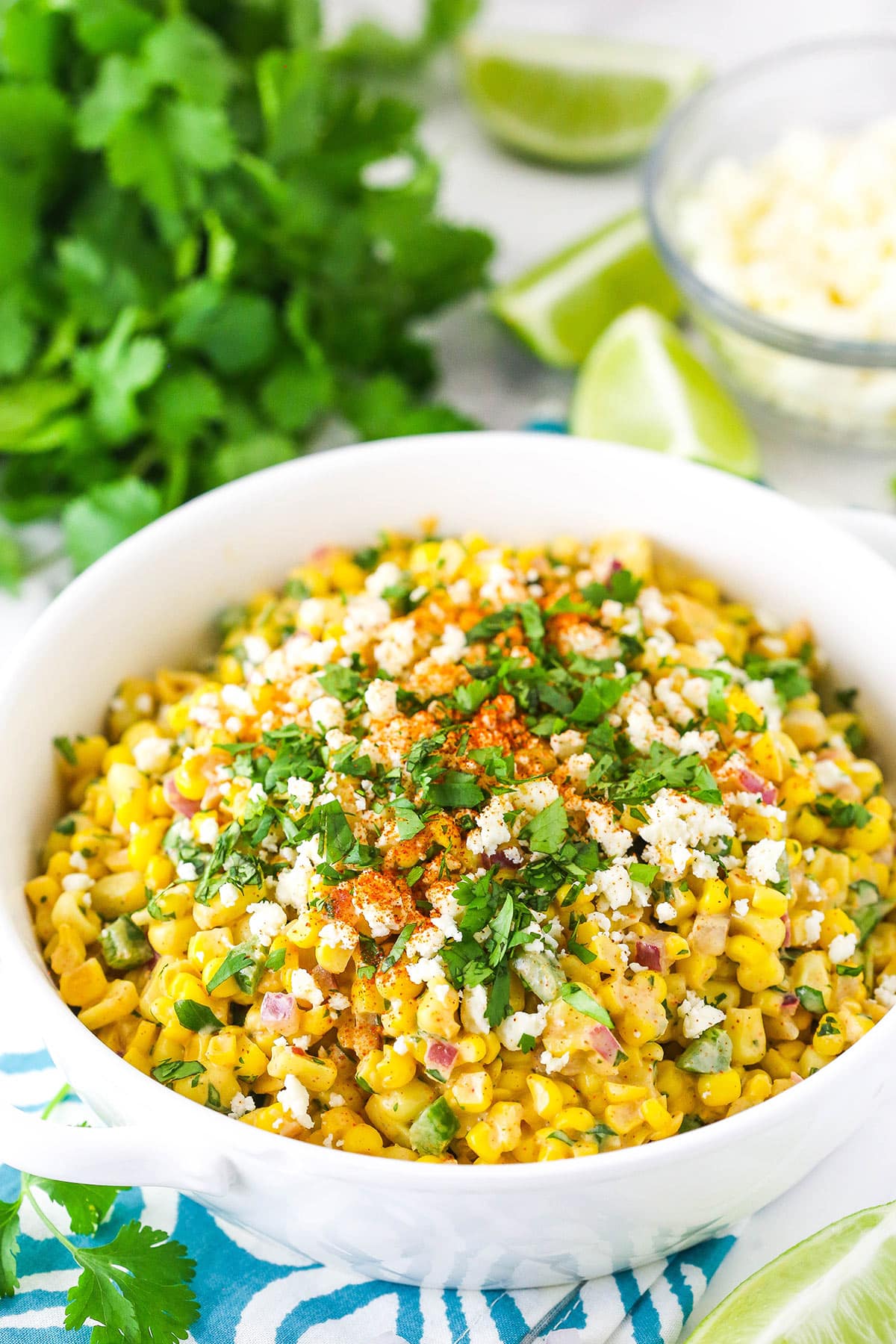 Mexican street corn salad is creamy, zesty, and smoky with just the right amount of spice to complement the sweetness of the corn. Um, yum! Mexican street corn salad in a bowl.