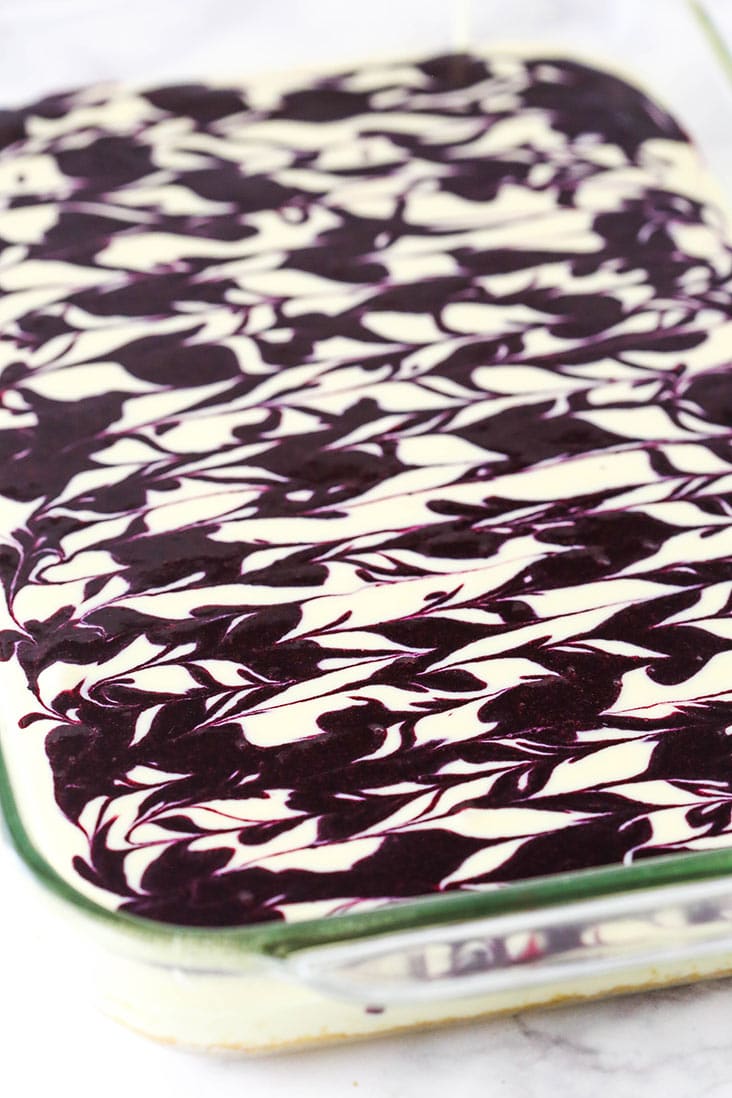 Blueberry swirl cheesecake ready to be baked