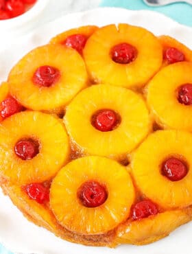 A pineapple upside down cake with cherries
