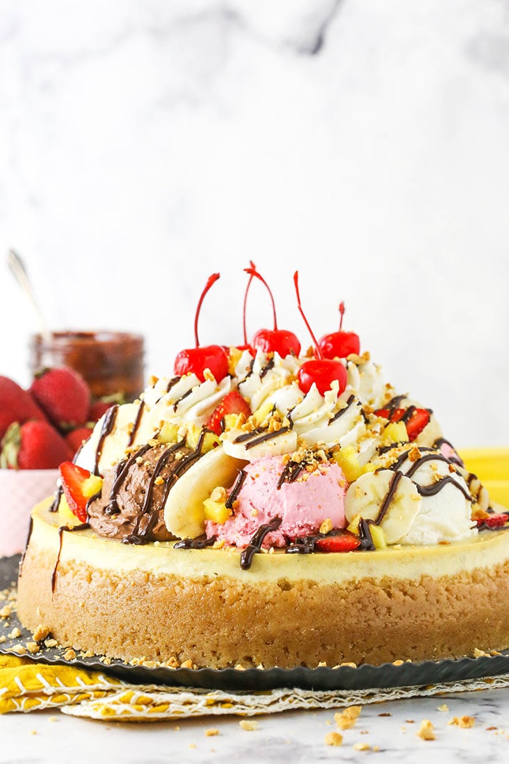 banana split cheesecake from the side on metal serving tray