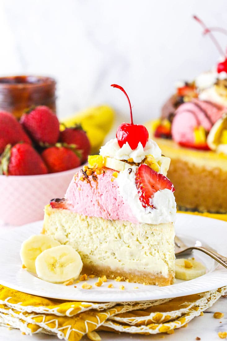 slice of banana split cheesecake on white plate and yellow napkin