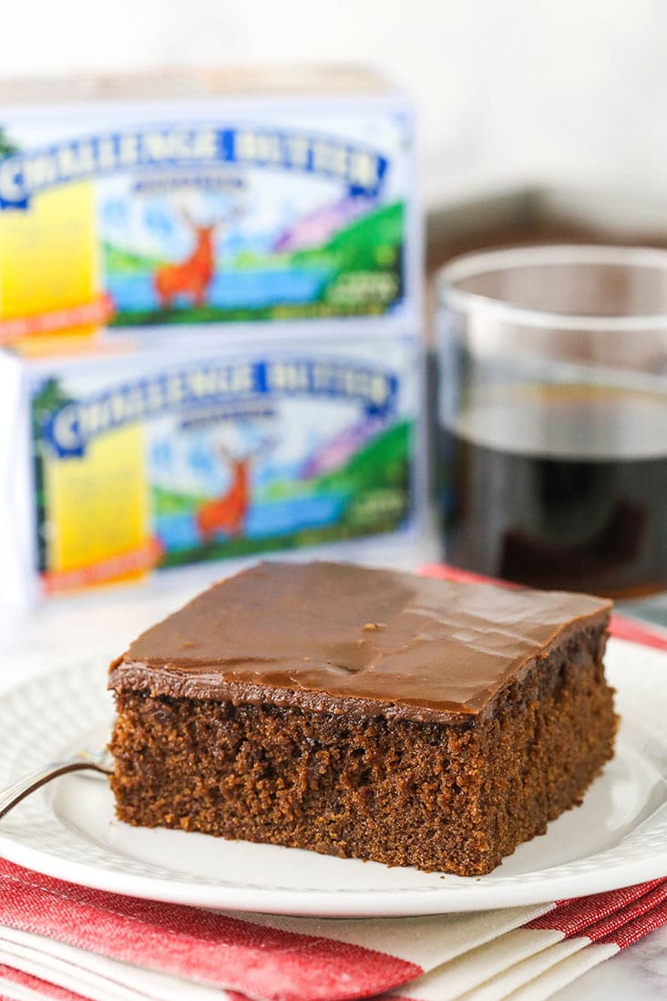 slice of coca cola cake with challenge butter in background