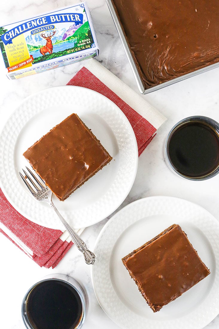 overhead image of two slices of cake on white plates with challenge butter