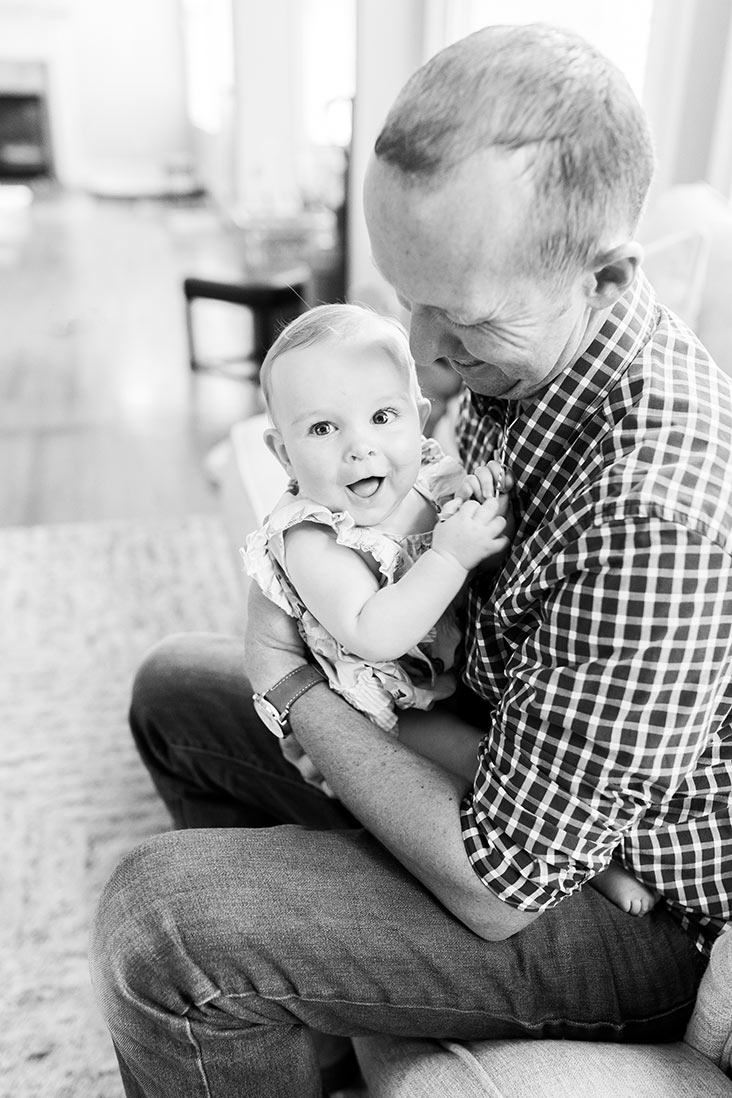 Ian holding McKenzie with her smiling