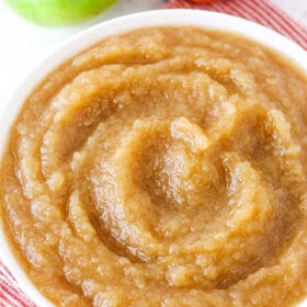 A white bowl of homemade applesauce