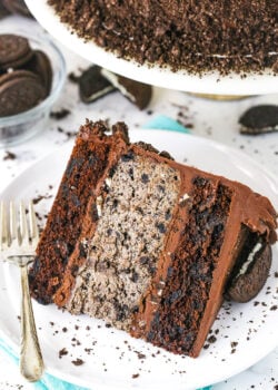 A slice of cookies and cream cheesecake cake