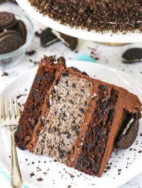 A slice of cookies and cream cheesecake cake