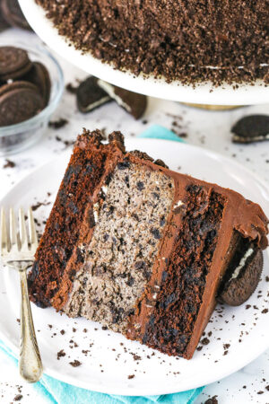 A slice of cookies and cream cheesecake cake