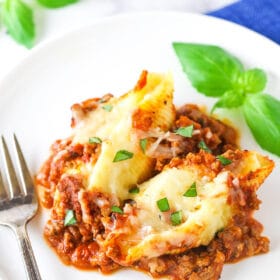 A serving of beefy Italian stuffed shells on a plate