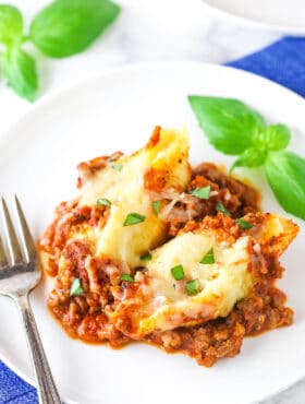 A serving of beefy Italian stuffed shells on a plate