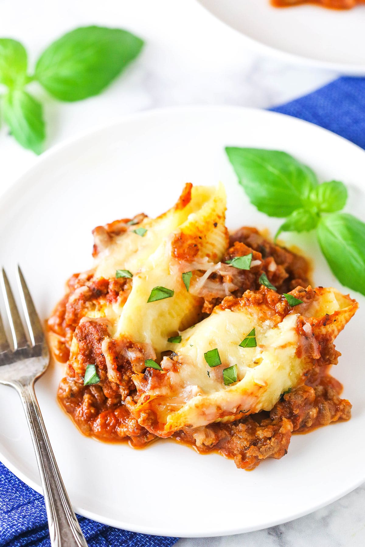 A serving of beefy Italian stuffed shells on a plate