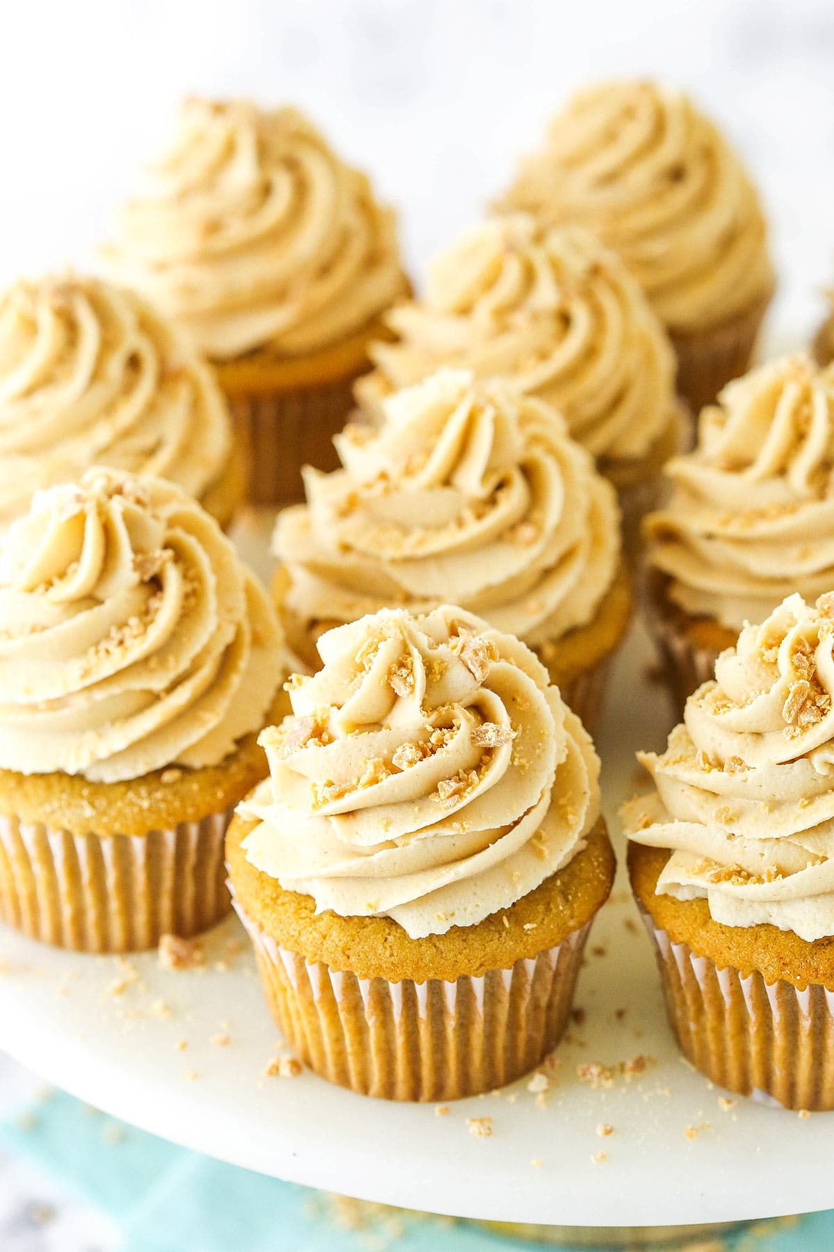 Peanut butter cupcakes with peanut butter frosting and crushed peanut butter chips on top