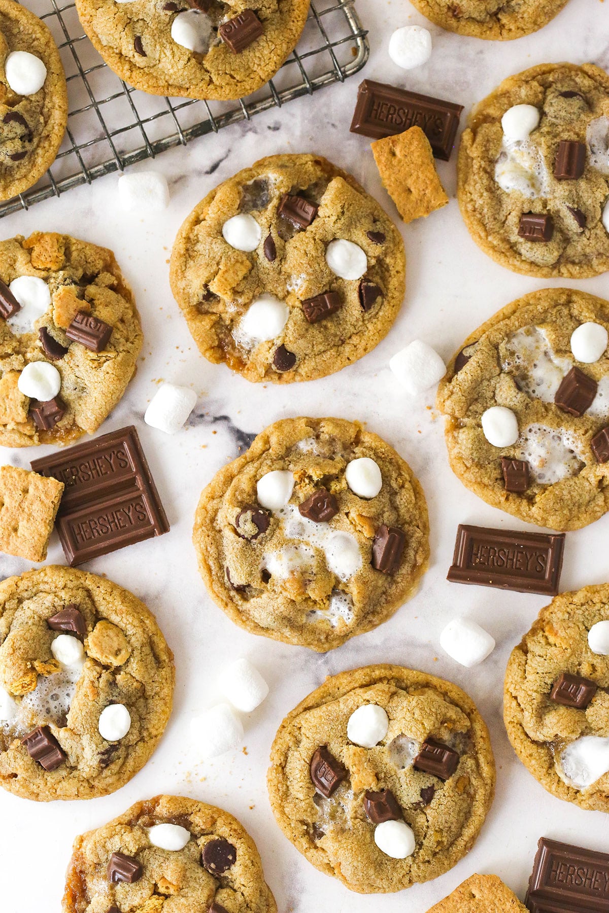 Every bite of these s’mores cookies is loaded with rich chocolate, gooey marshmallows, and sweet graham crackers. Overhead view of s'mores cookies on the counter
