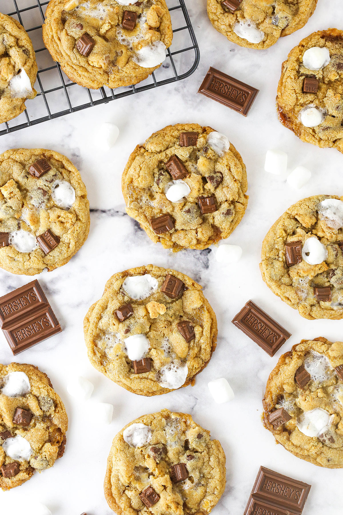 Lots of s'mores cookies sitting on a marble table.