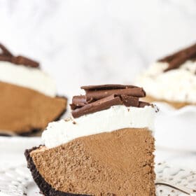 A slice of French silk pie on a white plate.