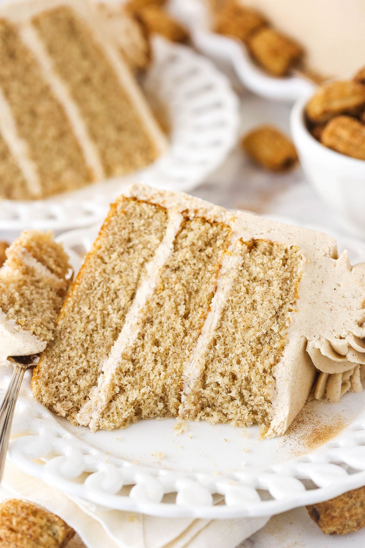 slice of churro cake with a bite taken out