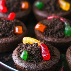 A close-up shot of Halloween worm and dirt cookies on a rimmed cookie tray
