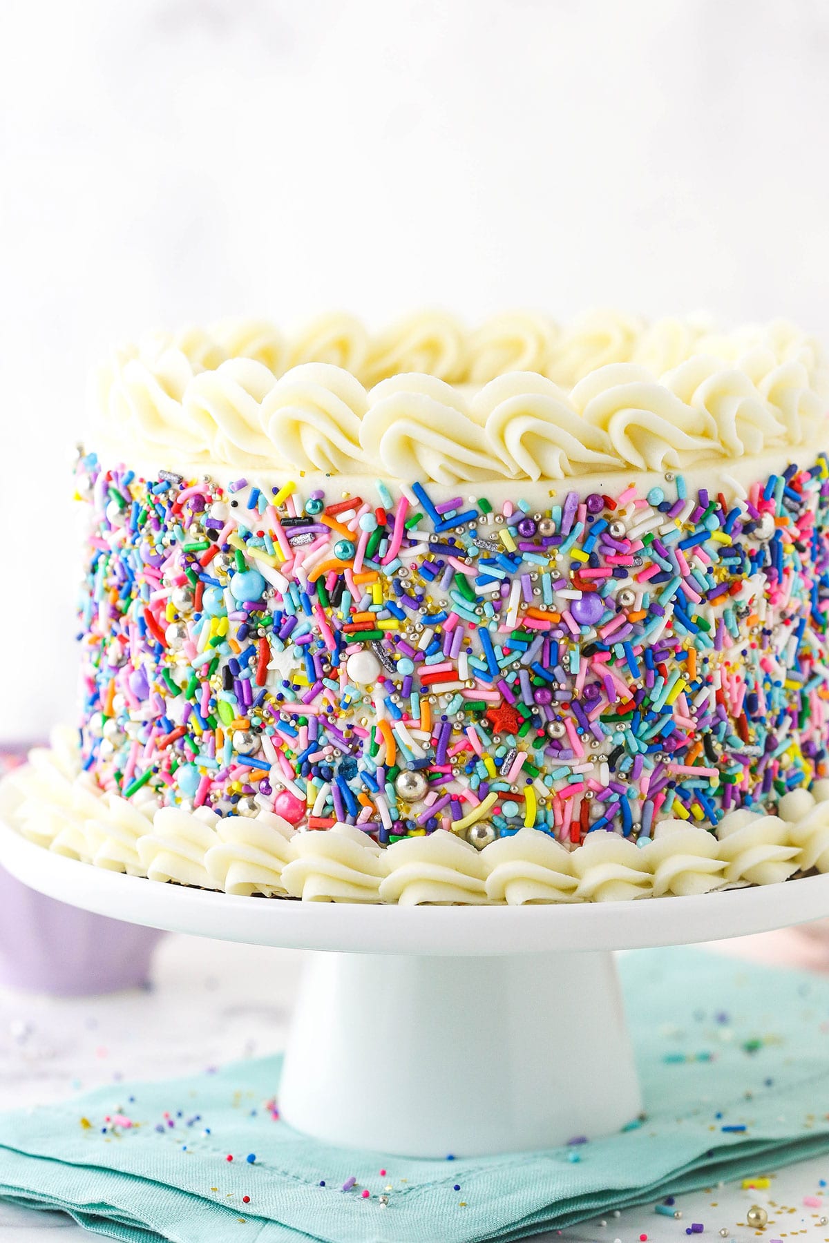 6 inch vanilla cake on white cake stand