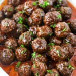 Grape Jelly Meatballs in a pile in white dish