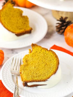 pumpkin pound cake slice on white plate with orange napkin