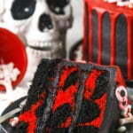 red and black. marble cake slice with skull in the background