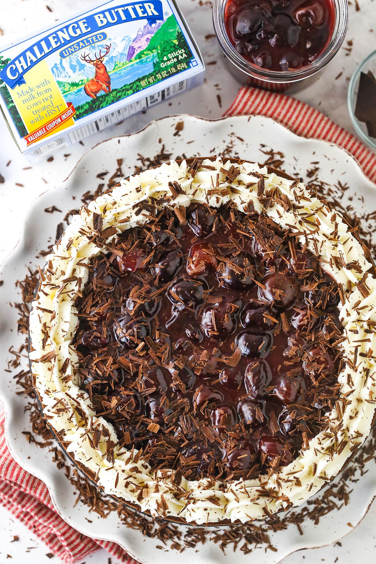 Black Forest Cheesecake with red stripped cloth and challenge butter