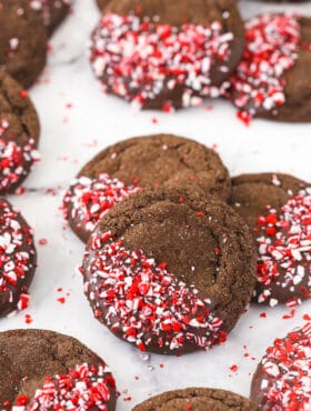 Chocolate peppermint sugar cookies arranged on a countertop in piles of three
