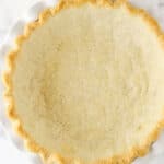 fully baked pie crust in white pie plate