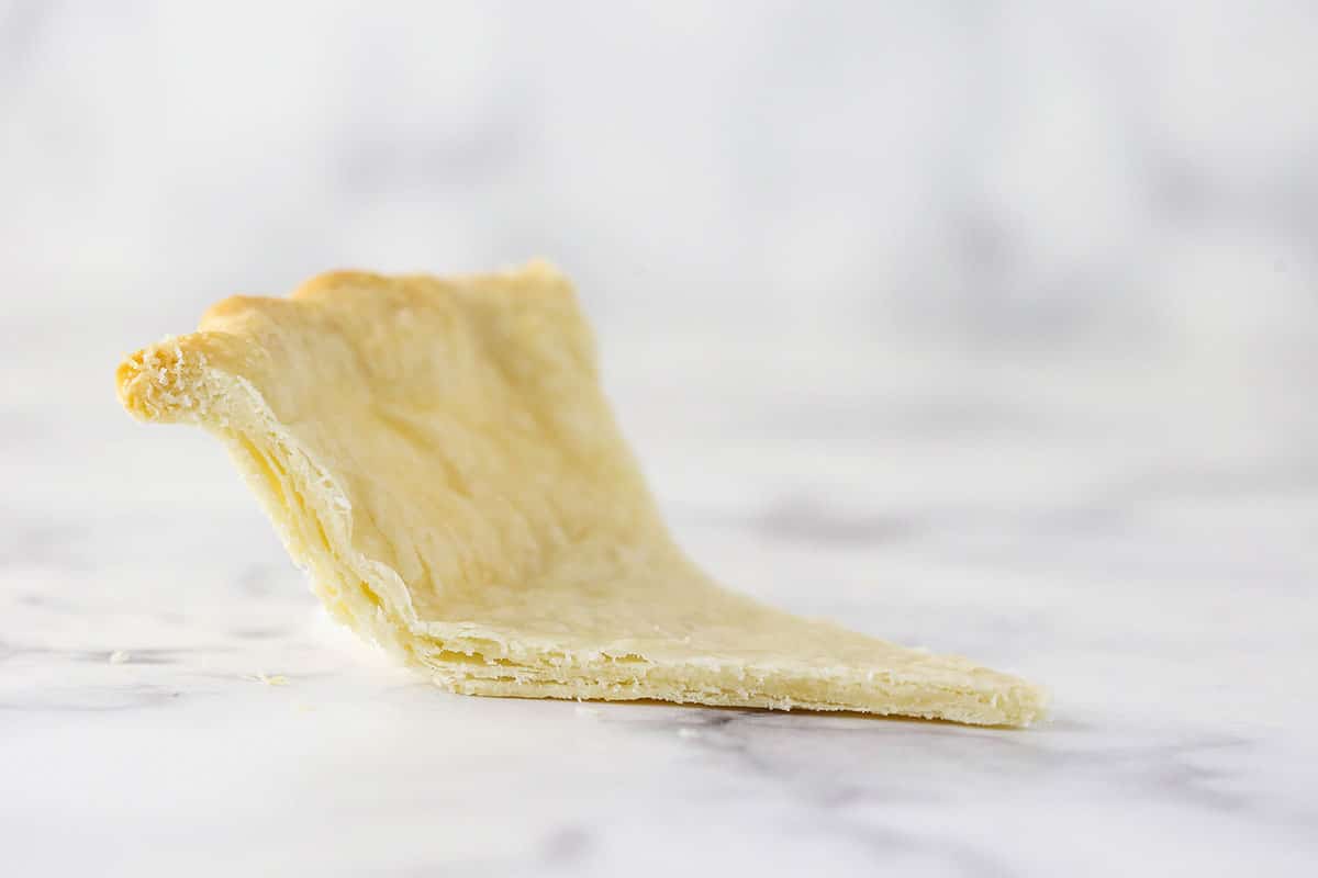 slice of pie crust from the side so you see the layers