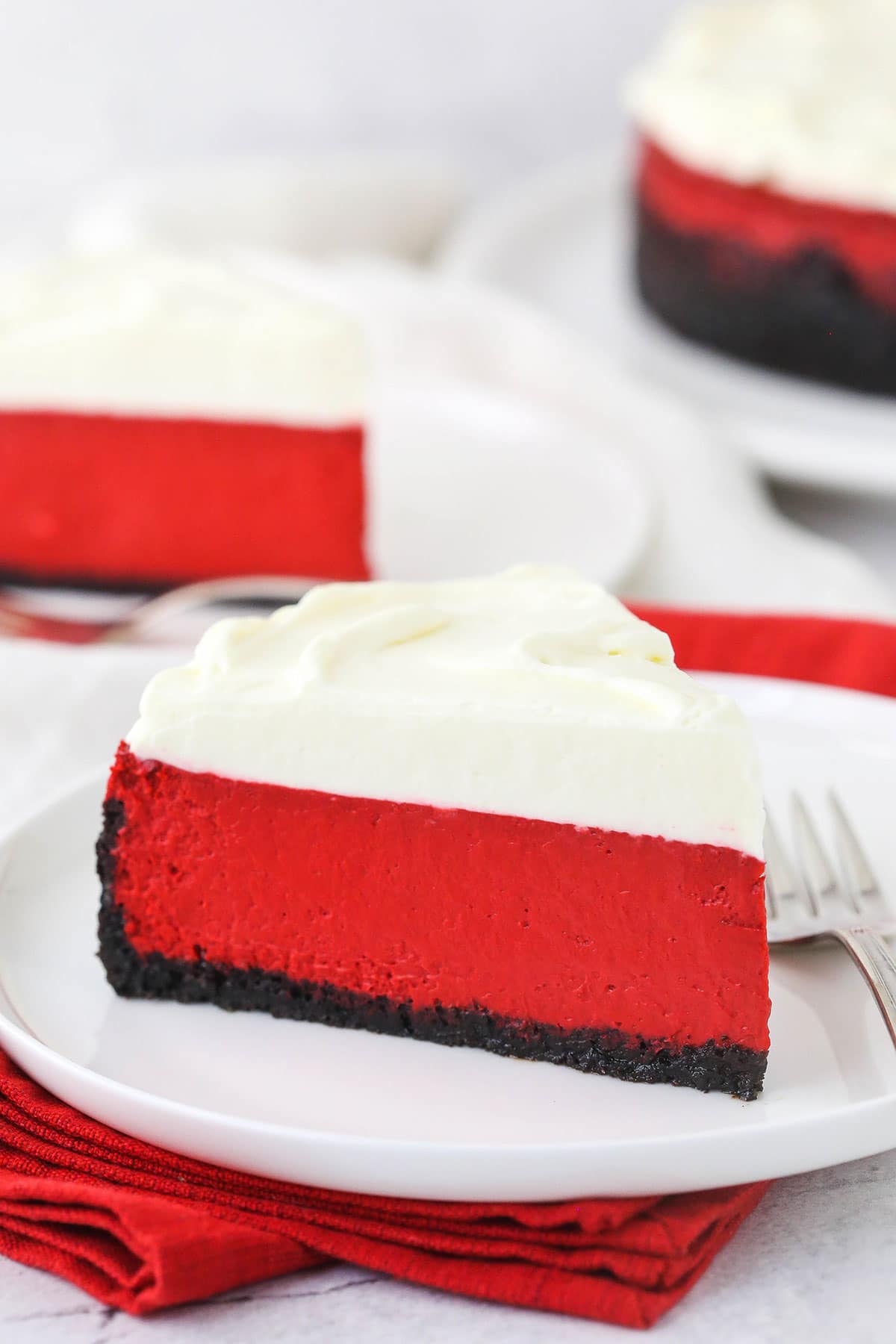 A slice of homemade cheesecake on a plate with a metal fork