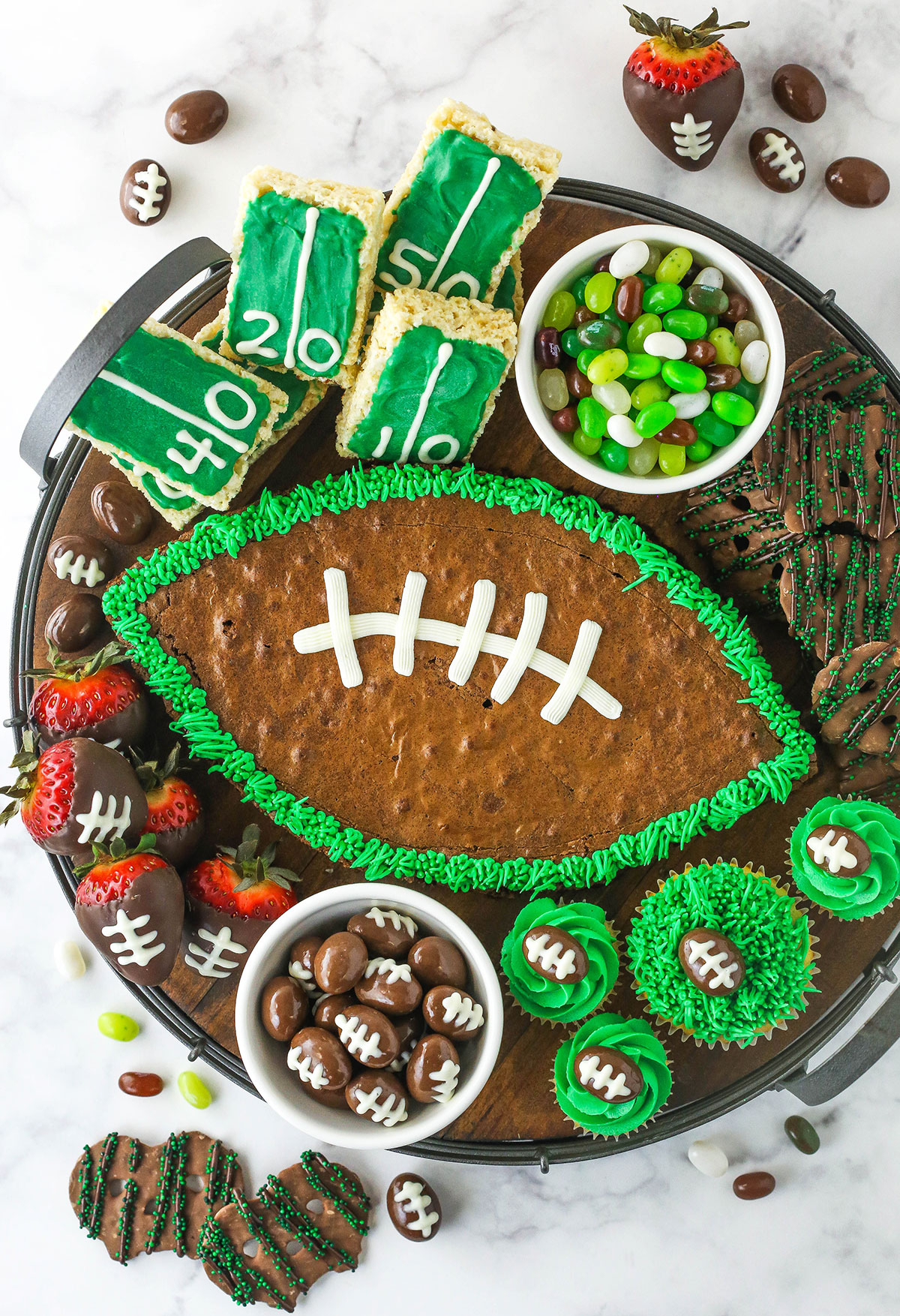 Football Dessert Board with green, brown and white treats