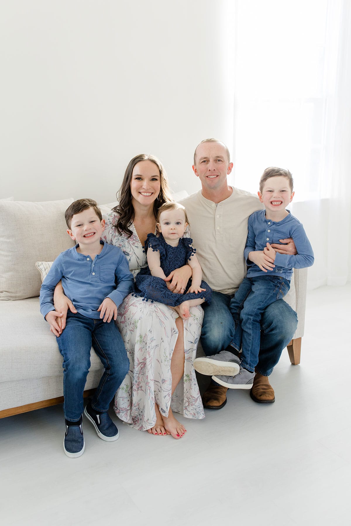 The five of us sitting on a cream colored couch