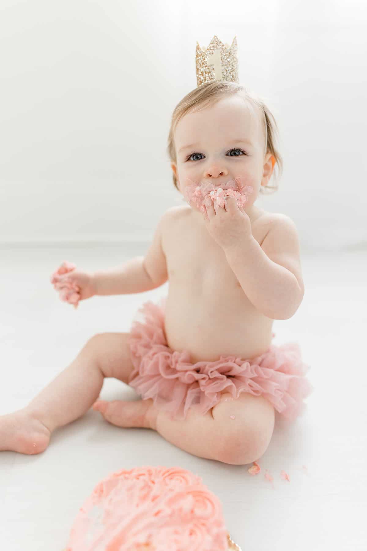 McKenzie taking a bit of a pink smash cake