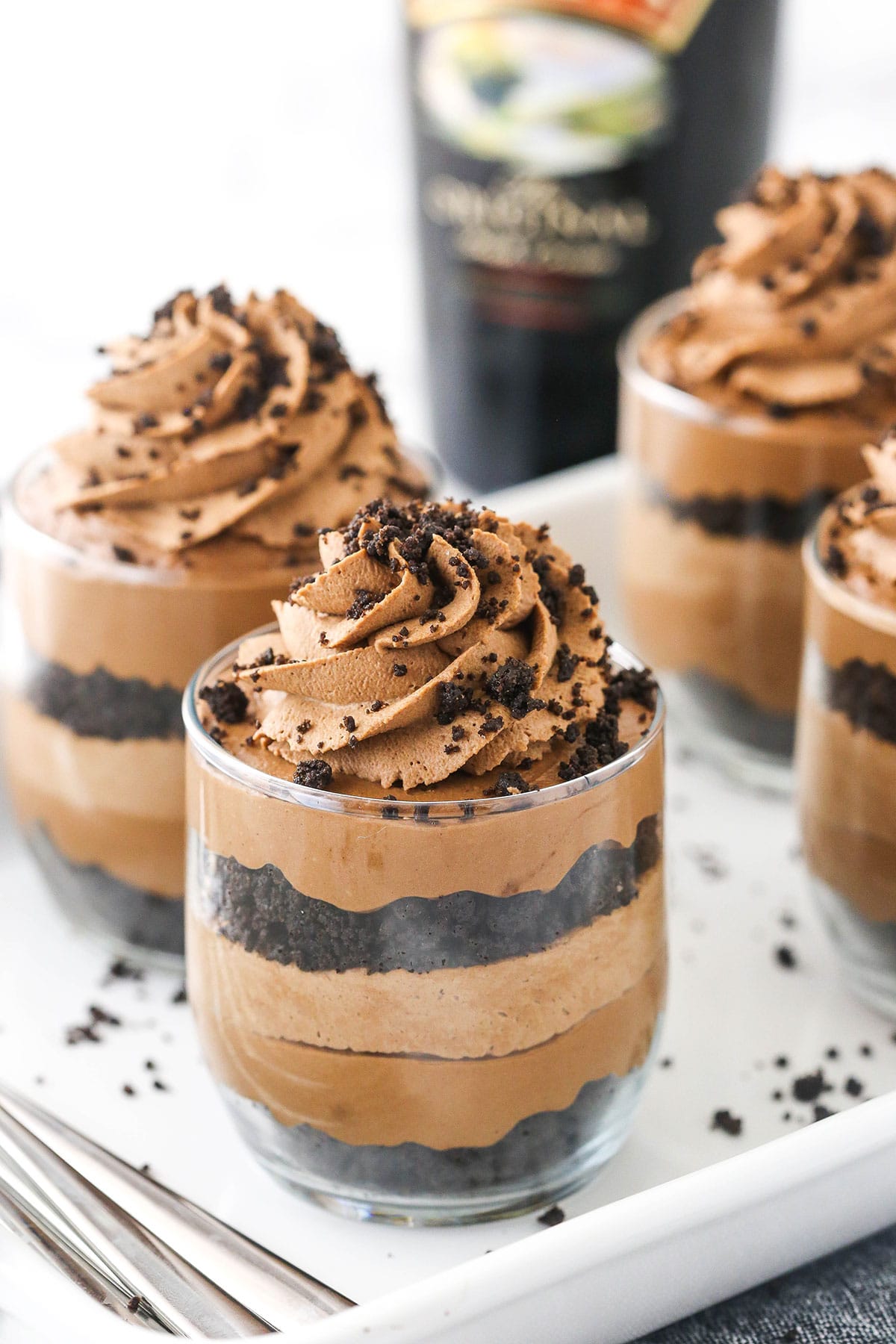 A tray of no-bake Baileys cheesecakes topped with Oreo cookie crumbs