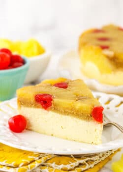 A slice of cheesecake on a plate, viewed from the side to show the texture of the layers.