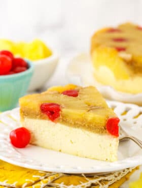 A slice of cheesecake on a plate, viewed from the side to show the texture of the layers.