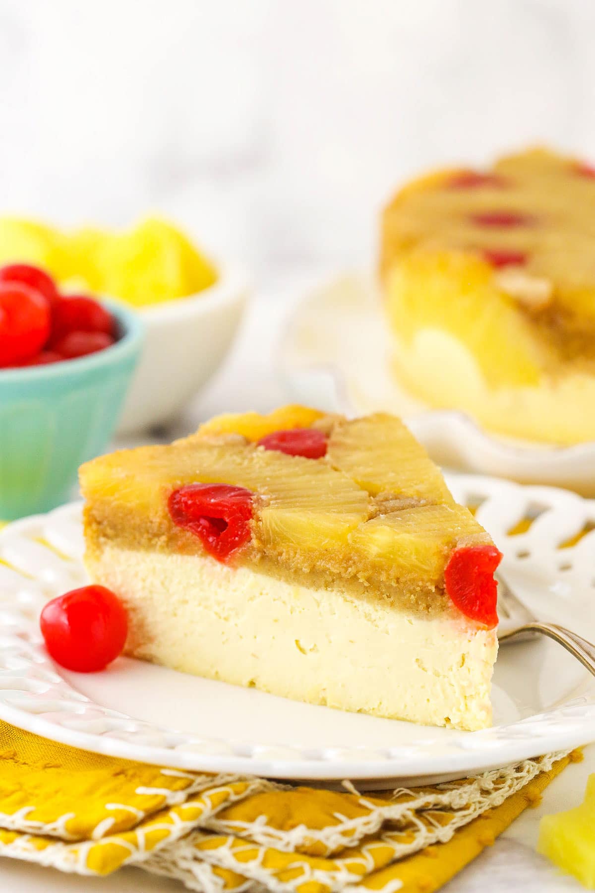 A slice of cheesecake on a plate, viewed from the side to show the texture of the layers.