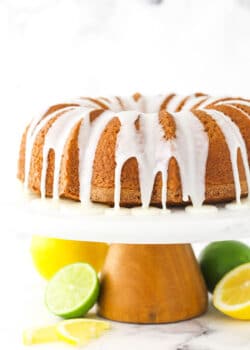 A lemon-lime bundt cake with homemade glaze dripping down the sides