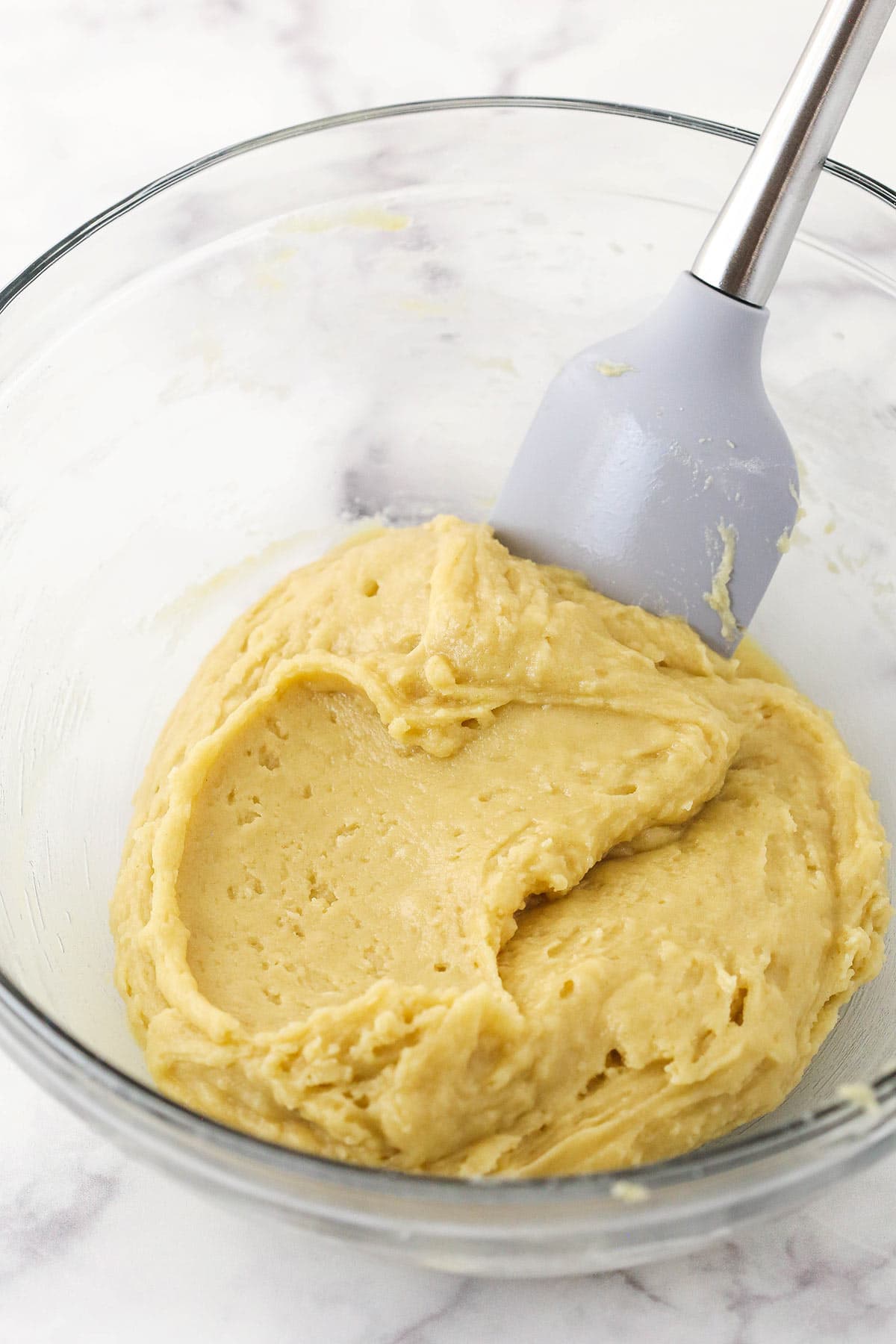 The muffin batter in a big mixing bowl before the berries have been folded in