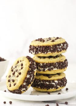 Three chipwiches stacked on top of each other with a fourth ice cream cookie sandwich leaning up against the stack