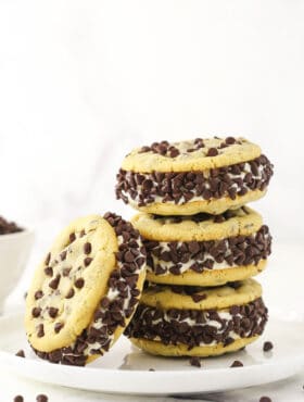 Three chipwiches stacked on top of each other with a fourth ice cream cookie sandwich leaning up against the stack