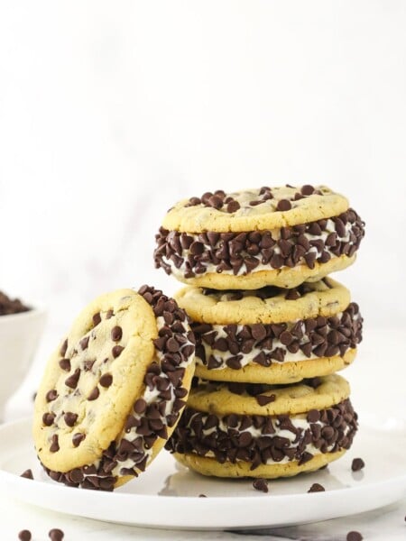 Three chipwiches stacked on top of each other with a fourth ice cream cookie sandwich leaning up against the stack