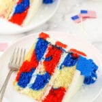 Three slices of red, white and blue marble cake on a granite kitchen countertop