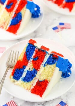 Three slices of red, white and blue marble cake on a granite kitchen countertop