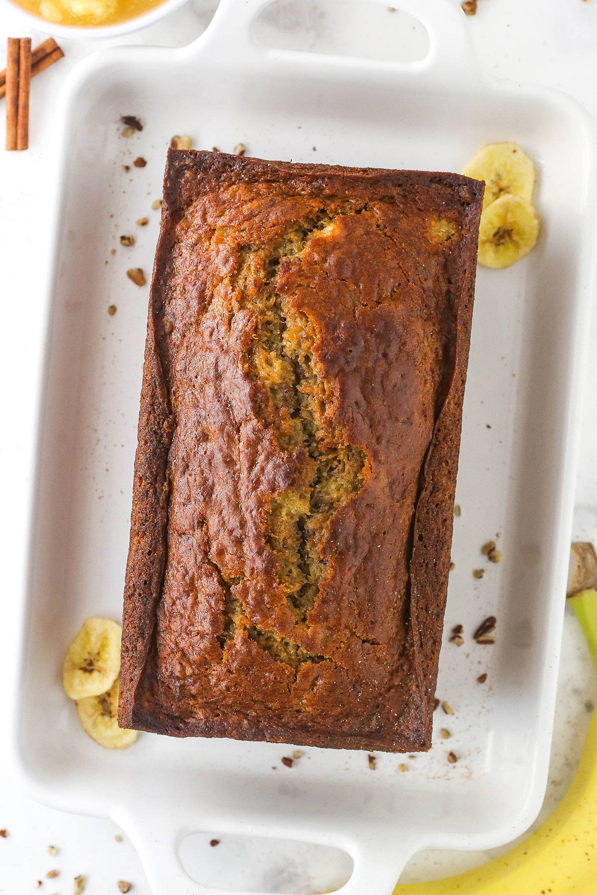 A homemade hummingbird loaf inside of a large baking dish with handles