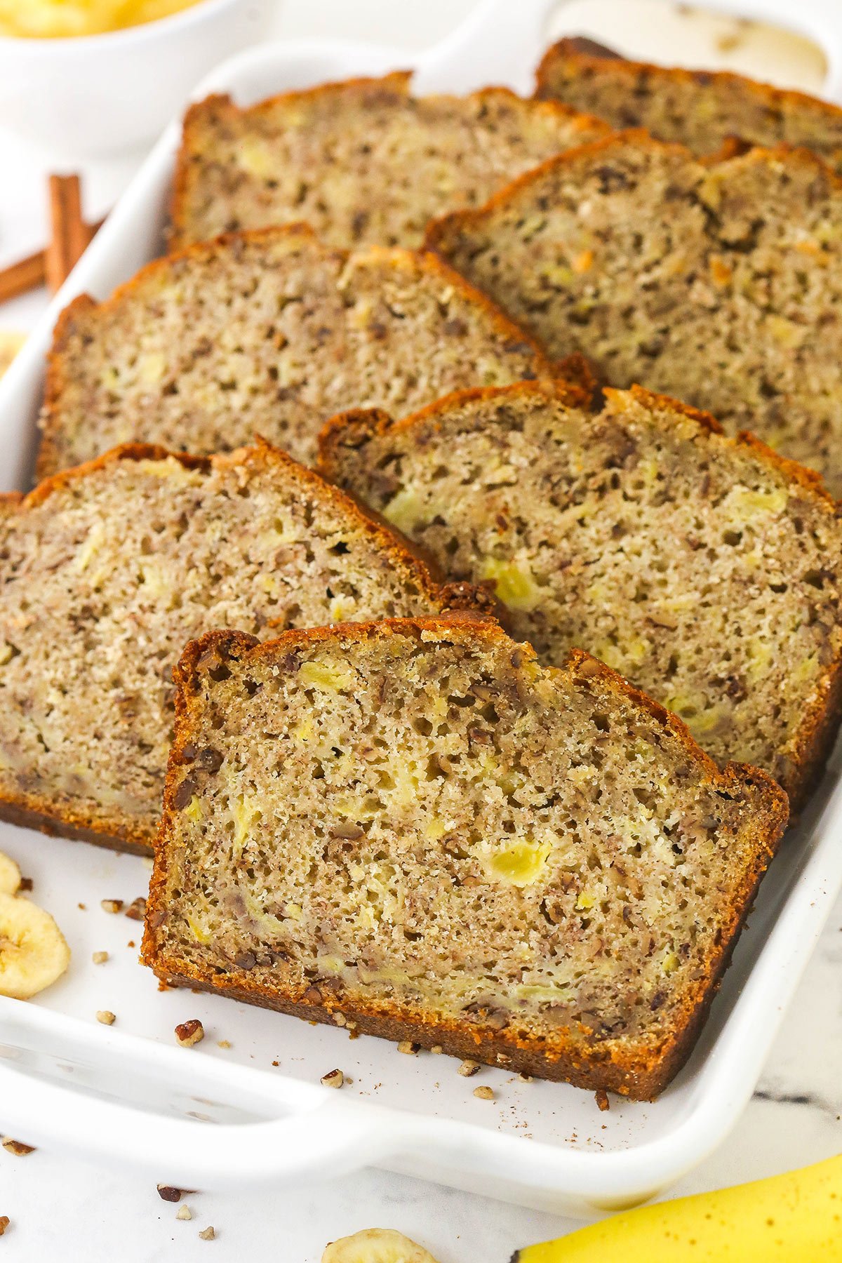 Seven pieces of pineapple banana bread inside of a large casserole dish