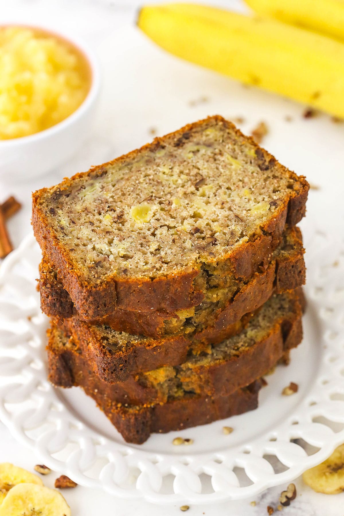 Five slices of hummingbird bread stacked on a single plate